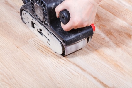 A belt sander in action